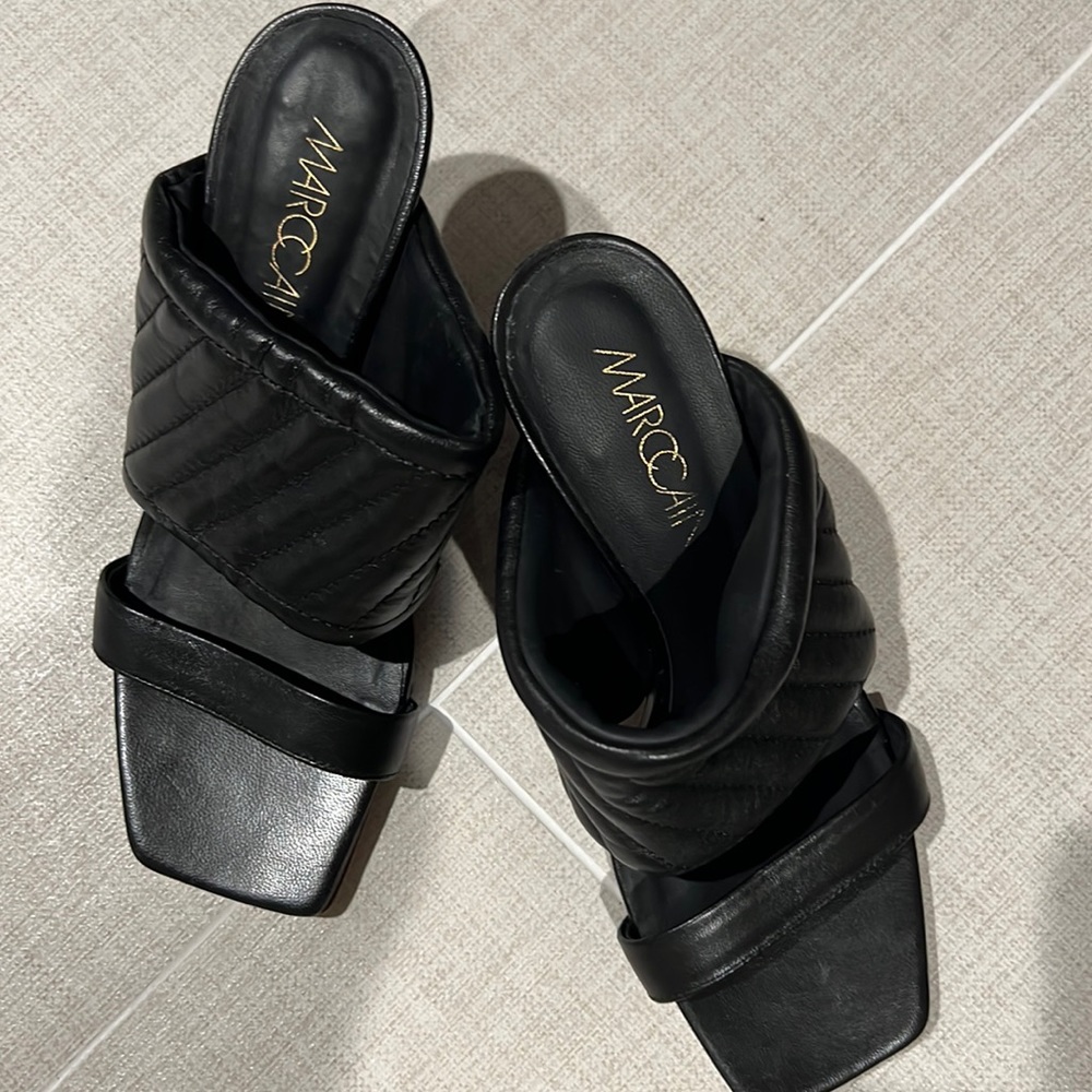 Women’s size 7.5 black mules. Never worn.